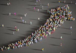 large group of people forming an arrow going up