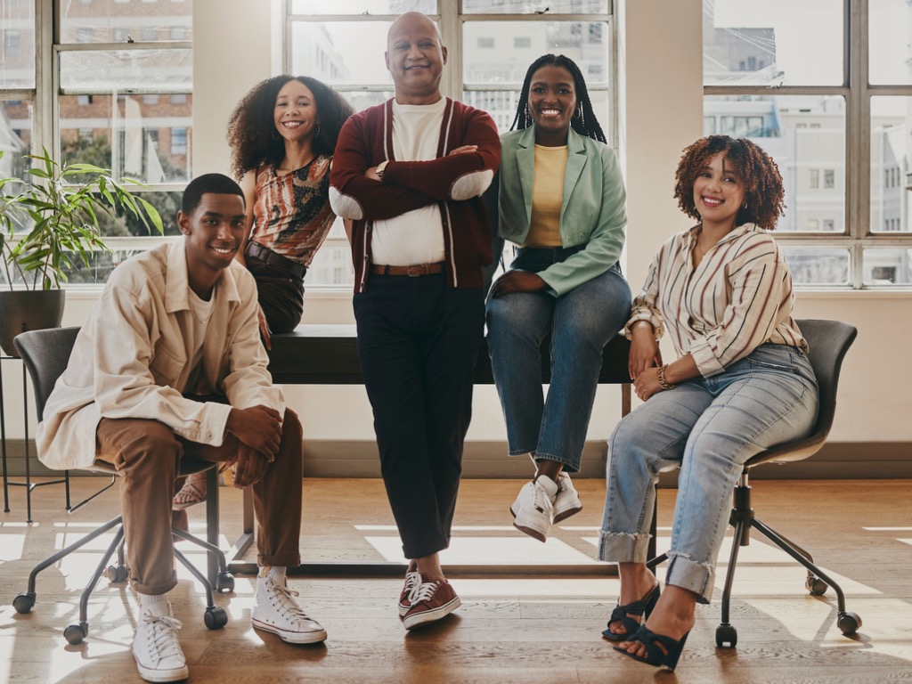 team-collaboration-and-portrait-of-business-people-in-office-leadership-and-contact-us-in Understanding the Vital Role of Very Small Nonprofits